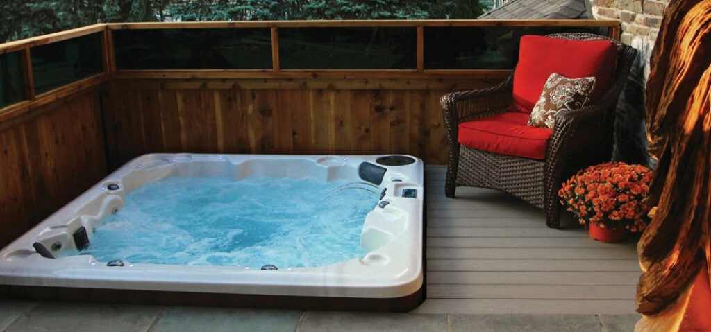 hot tub privacy ideas - recessed hot tub with a wood privacy fence