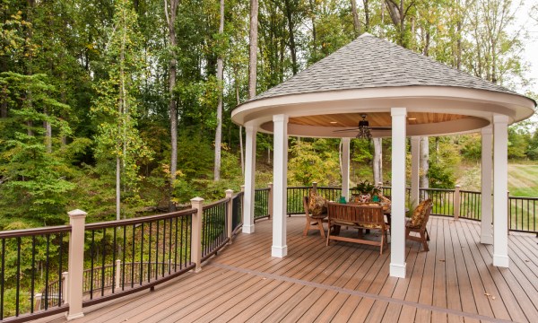 curved deck with a pergola and patio furniture